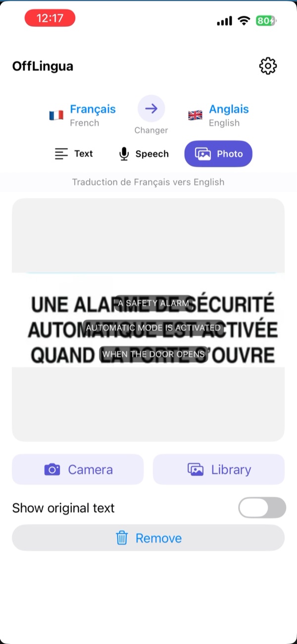 Modul Foto din OffLingua, cu text tradus în engleză peste un indicator în franceză.